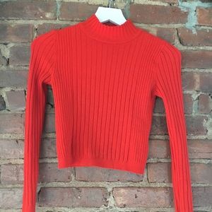 Bright red cropped sweater.